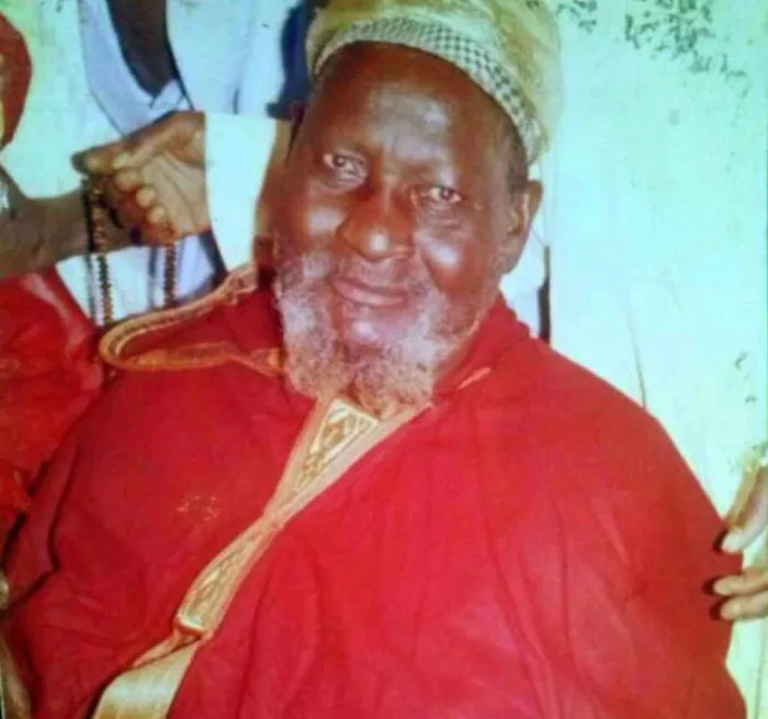 Elder wearing red traditional clothing